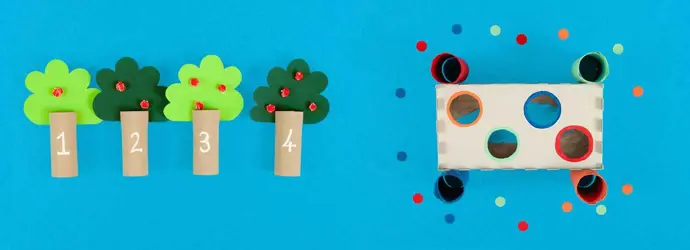 Spiele für die Entwicklung der Feinmotorik aus leeren Toilettenpapierrollen und Taschentuchboxen