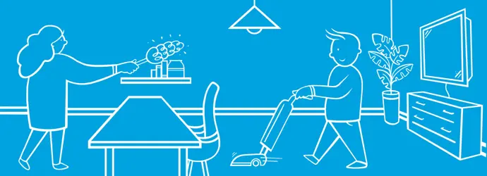 Vater und zwei Kinder, die Spaß haben, Aufgaben in der Lounge zu tun