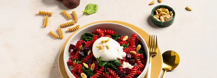 Beetroot pasta with spinach, burrata and roasted almonds